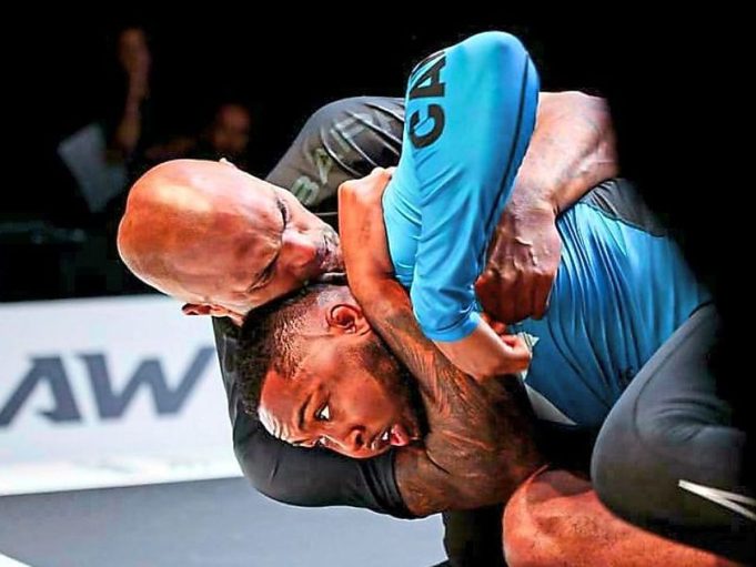 Former Wolves goalkeeper Carl Ikeme has an opponent at his mercy in a headlock during a jiu-jitsu competition